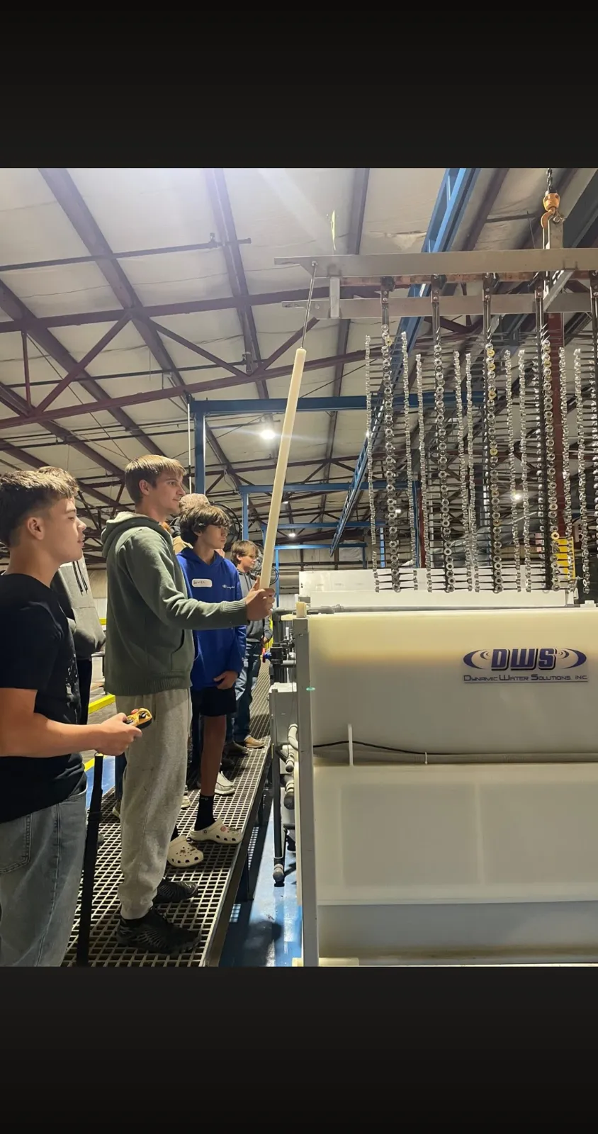 Students racking parts during a plant tour at AnoPRO