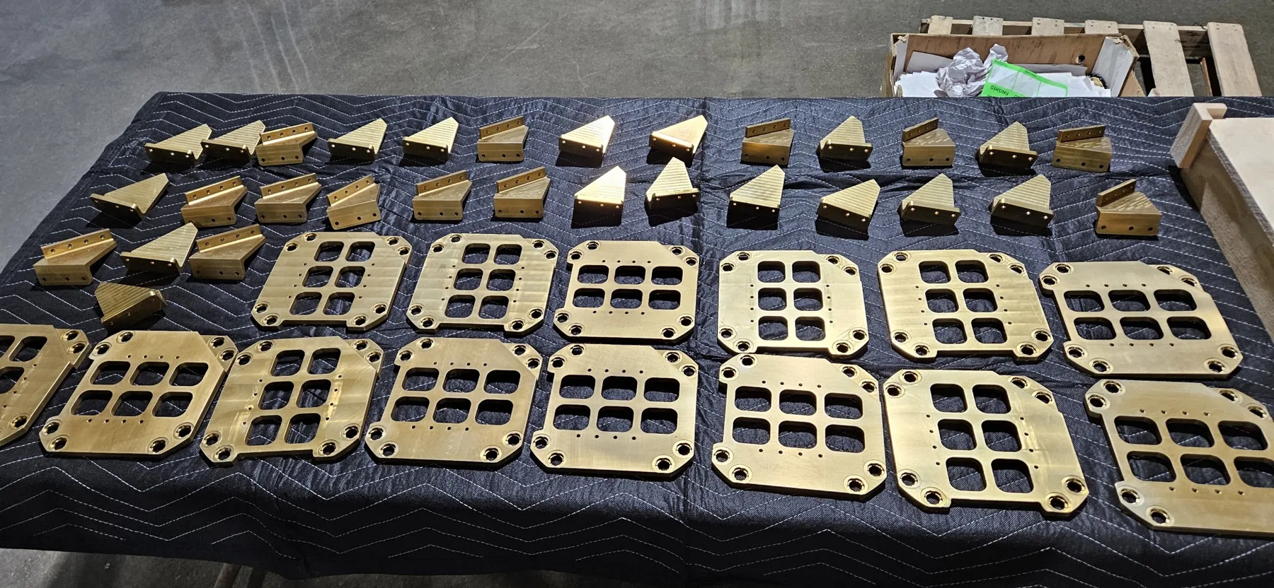 Gold anodized manifold plates and brackets finished at AnoPRO